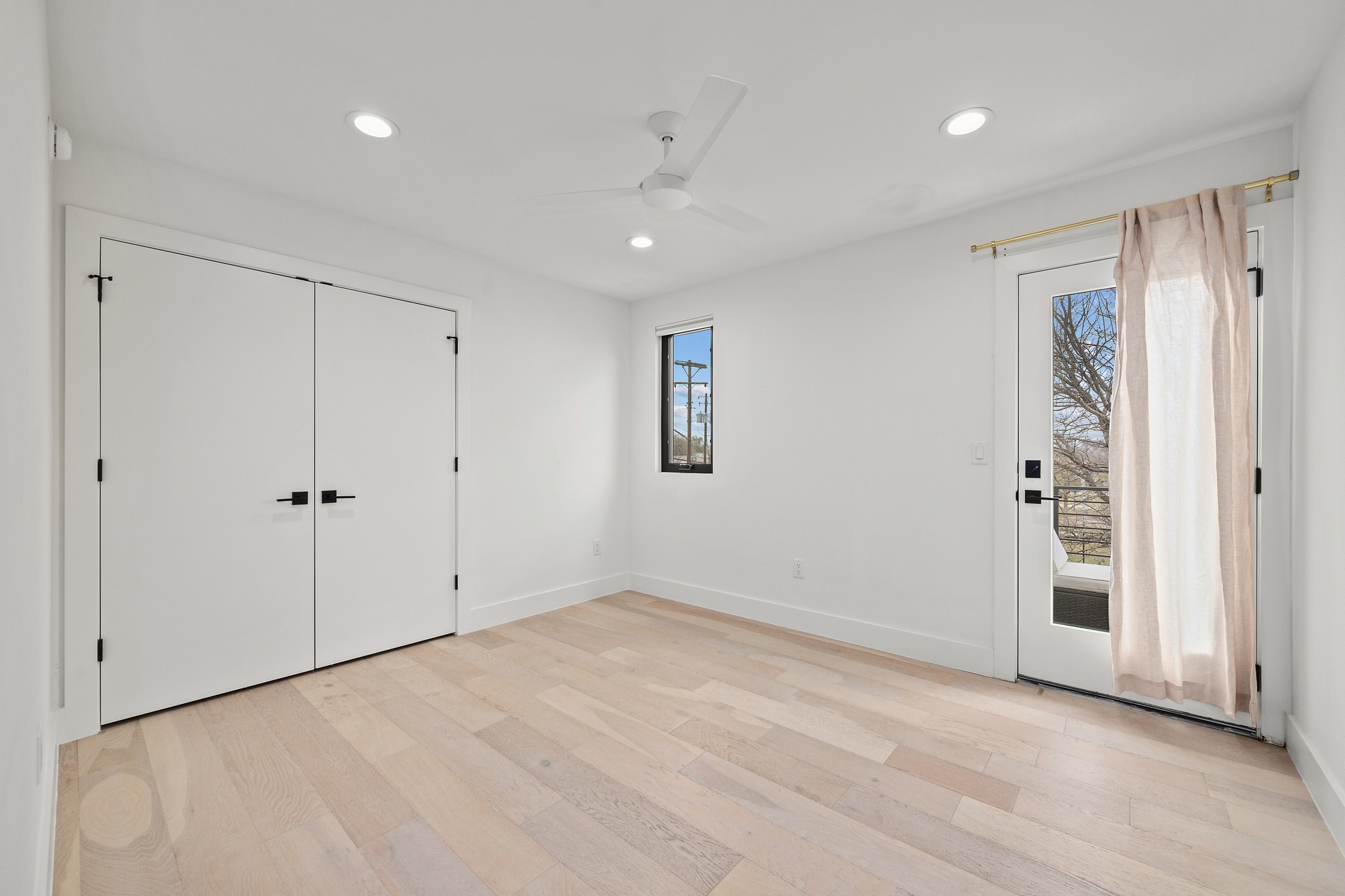 503 Havana Street, Unit A Austin, TX 78704 - Photo 14 of 28 Bedroom featuring recessed lighting, access to outside, ceiling fan, light wood-style flooring, and a closet