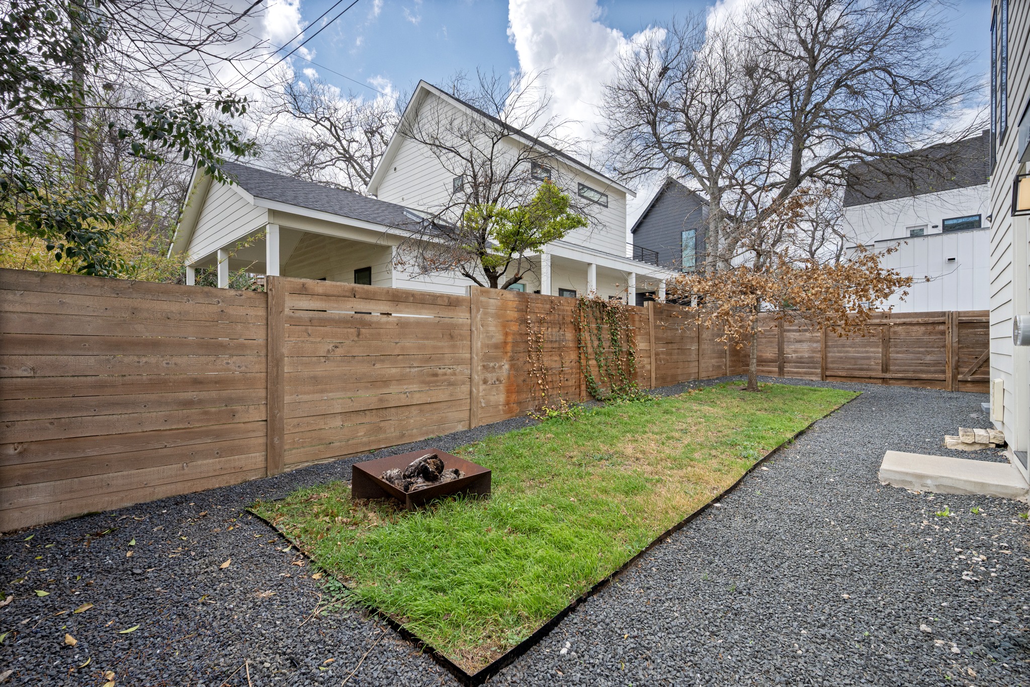 503 Havana Street, Unit A Austin, TX 78704 - Photo 23 of 28 Fenced backyard featuring a fire pit