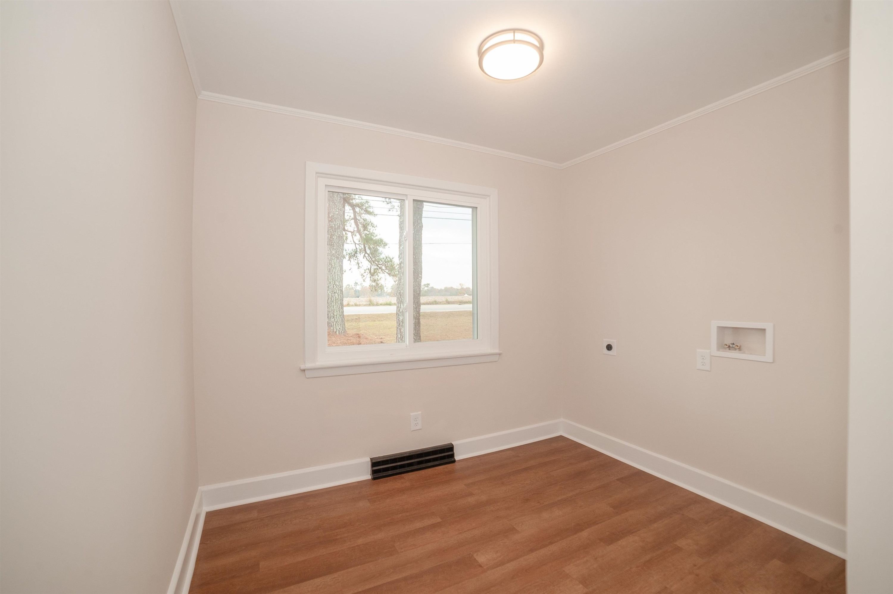 1206 Erwin Road Dunn, NC 28334 - Photo 12 of 24 an empty room with a window