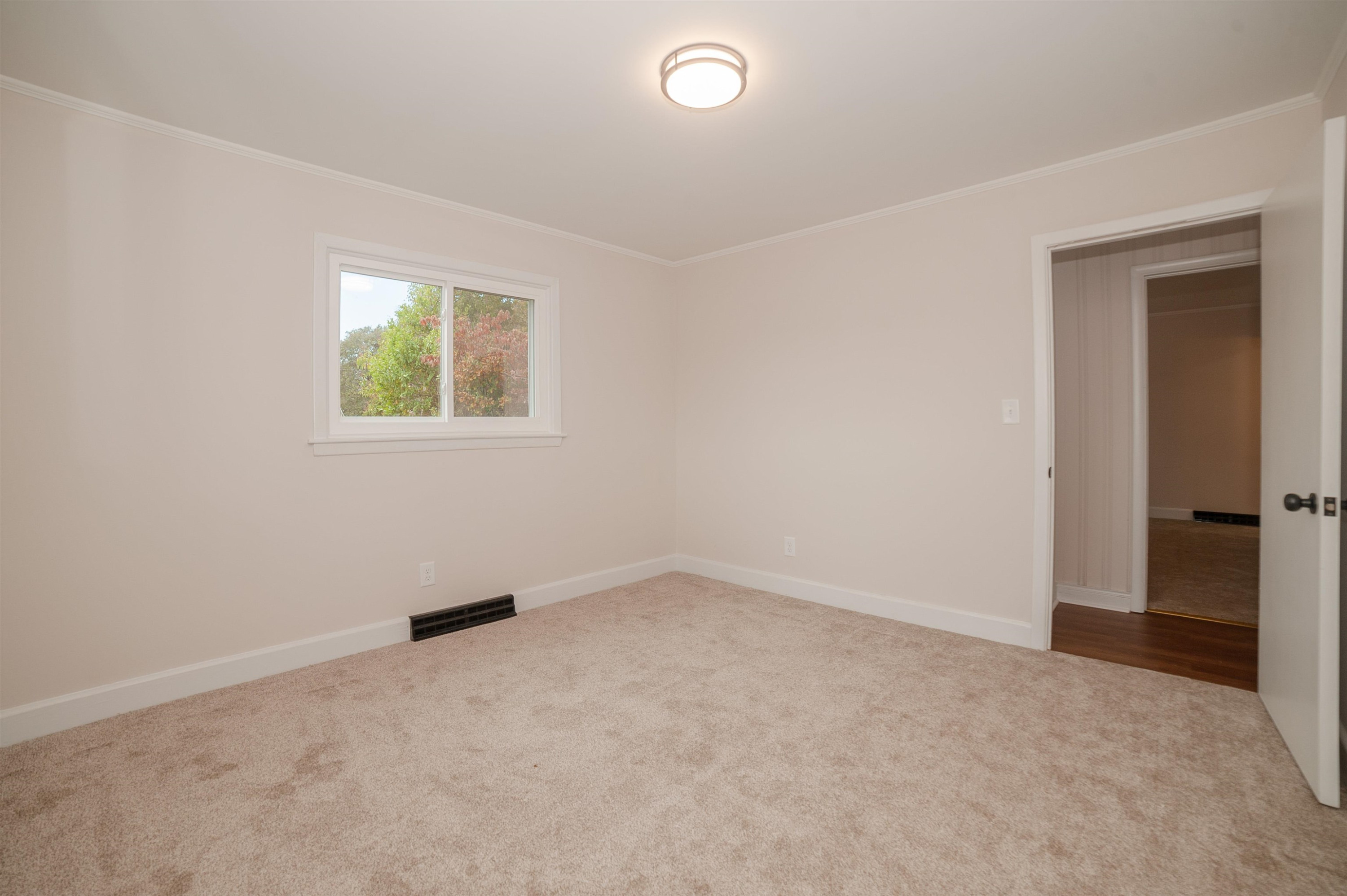 1206 Erwin Road Dunn, NC 28334 - Photo 17 of 24 an empty room with windows