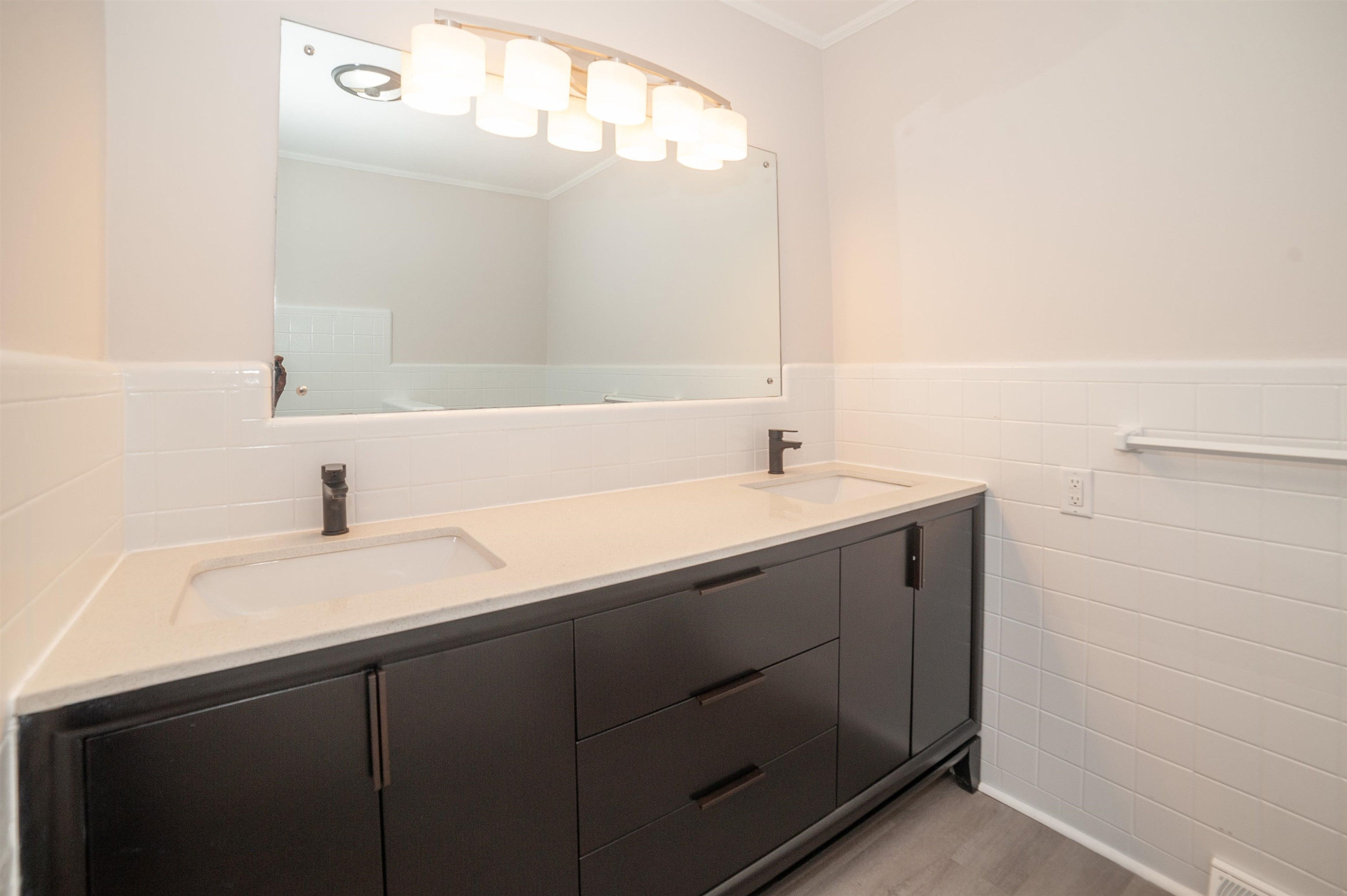 1206 Erwin Road Dunn, NC 28334 - Photo 19 of 24 a bathroom with a sink and a mirror