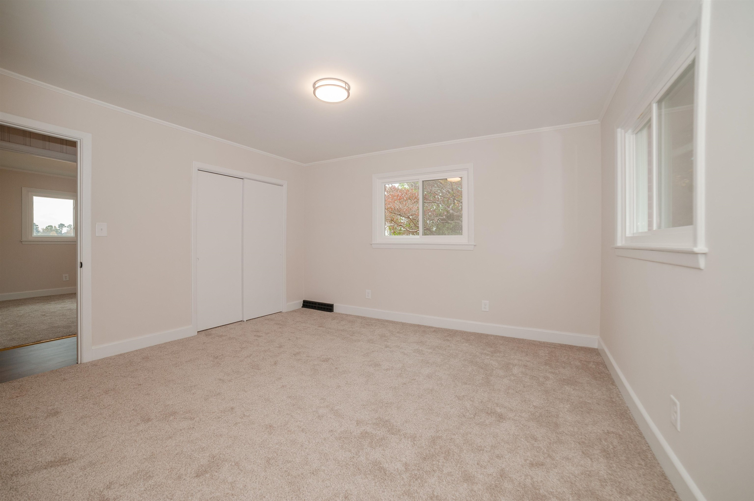 1206 Erwin Road Dunn, NC 28334 - Photo 20 of 24 an empty room with windows