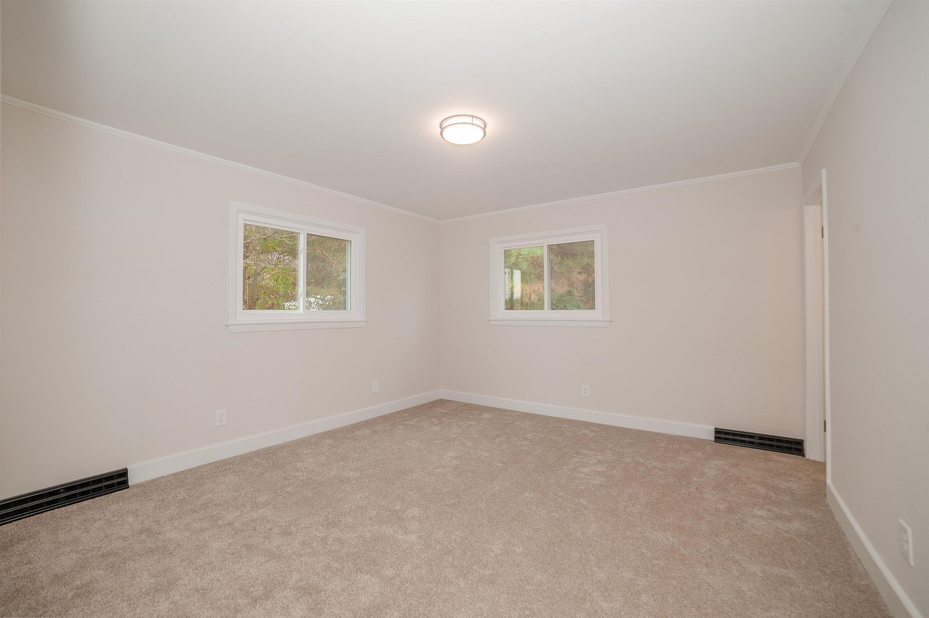 1206 Erwin Road Dunn, NC 28334 - Photo 21 of 24 an empty room with a window