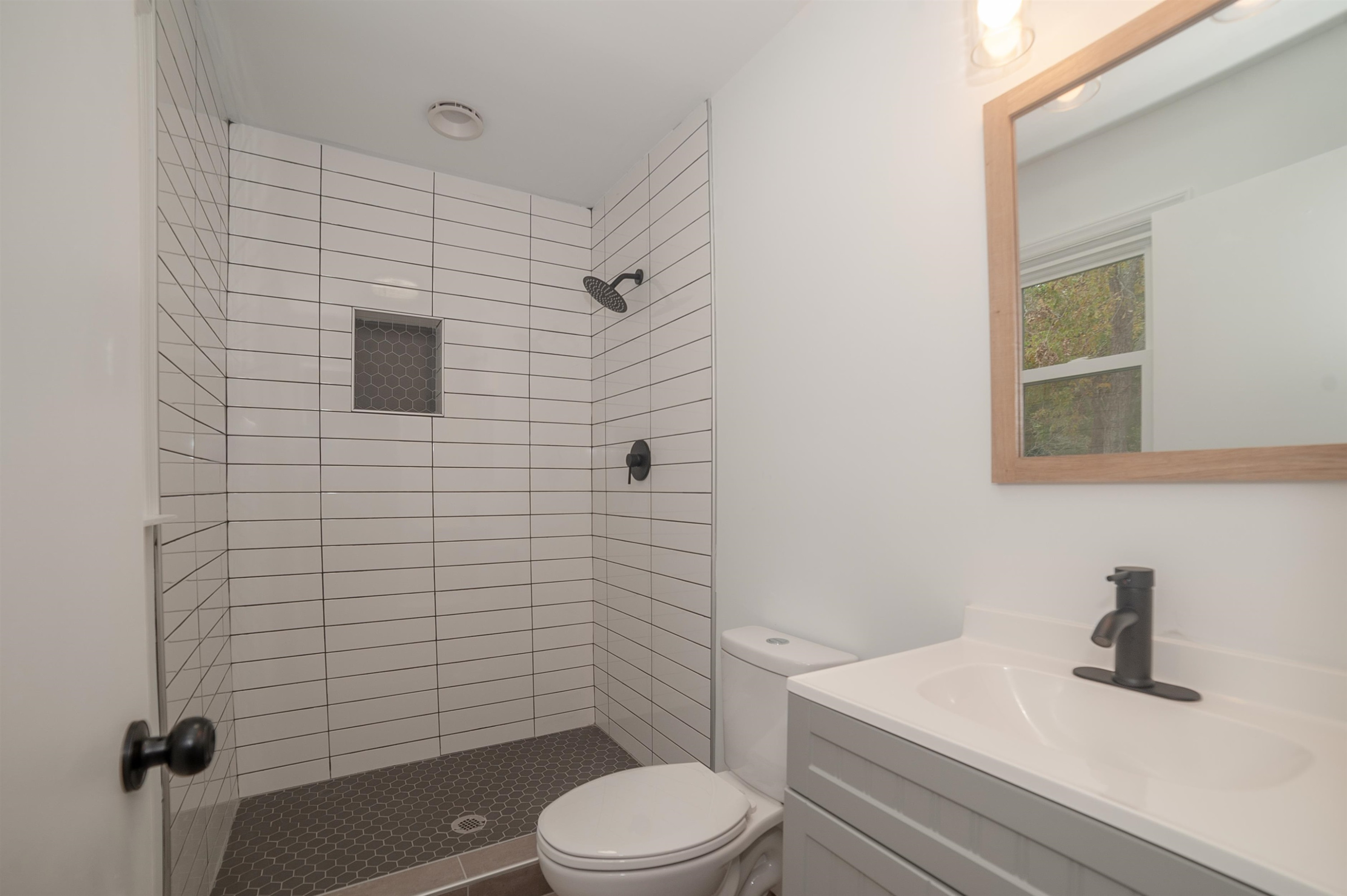 1206 Erwin Road Dunn, NC 28334 - Photo 23 of 24 a bathroom with a sink a toilet and shower