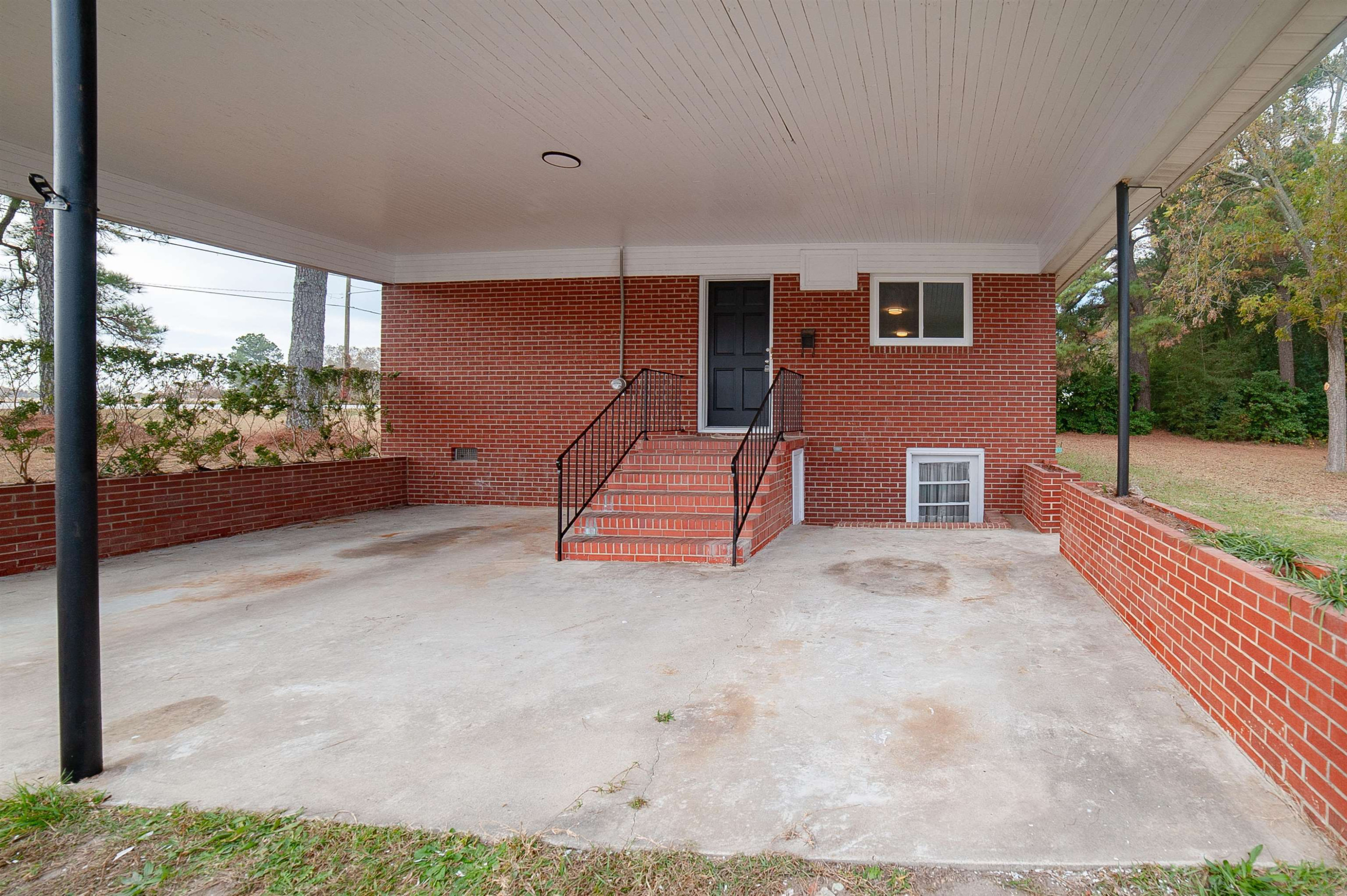 1206 Erwin Road Dunn, NC 28334 - Photo 4 of 24 a view of a livingroom with furniture and staircase