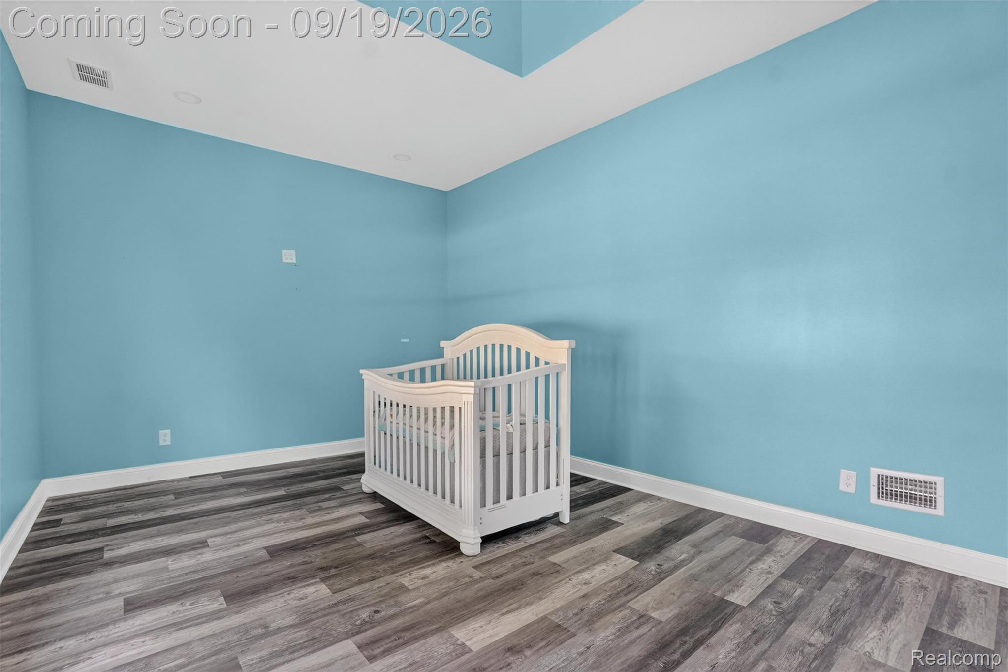10215 West Mount Morris Road Flushing, MI 48433 - Photo 28 of 58 Recessed lighting, wood-finish flooring, and a tray ceiling