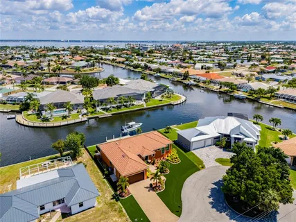 an aerial view of a house with a lake view