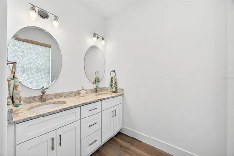 a bedroom with furniture and a rug