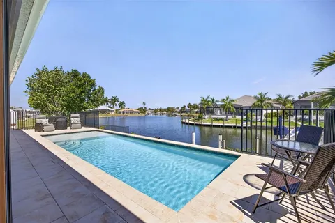a view of a swimming pool with a lounge chair