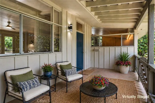 a outdoor living space with furniture and a potted plant