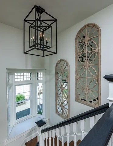 a front view of a house with large windows