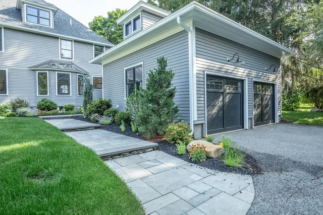 a view of a house with a yard and plants