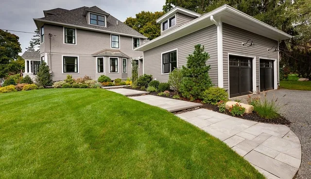 a front view of a house with garden