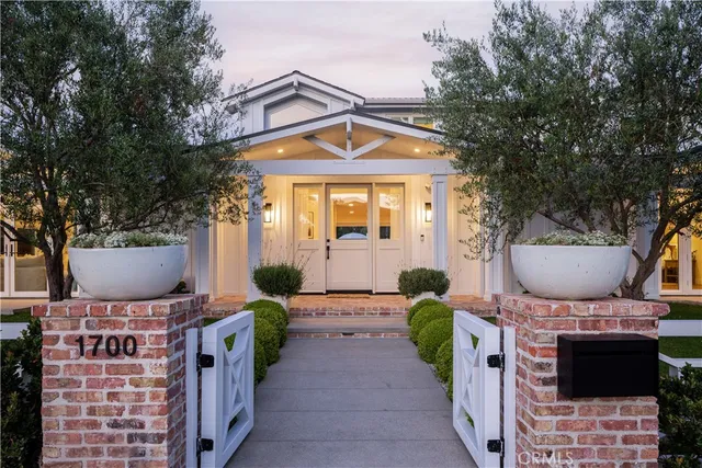 a front view of house with outdoor seating yard and barbeque oven
