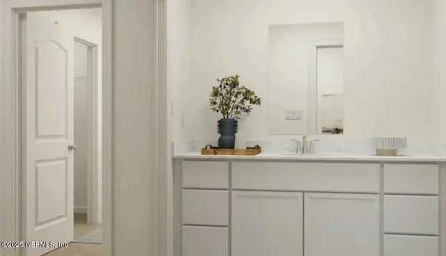 a living room with furniture and floor to ceiling window