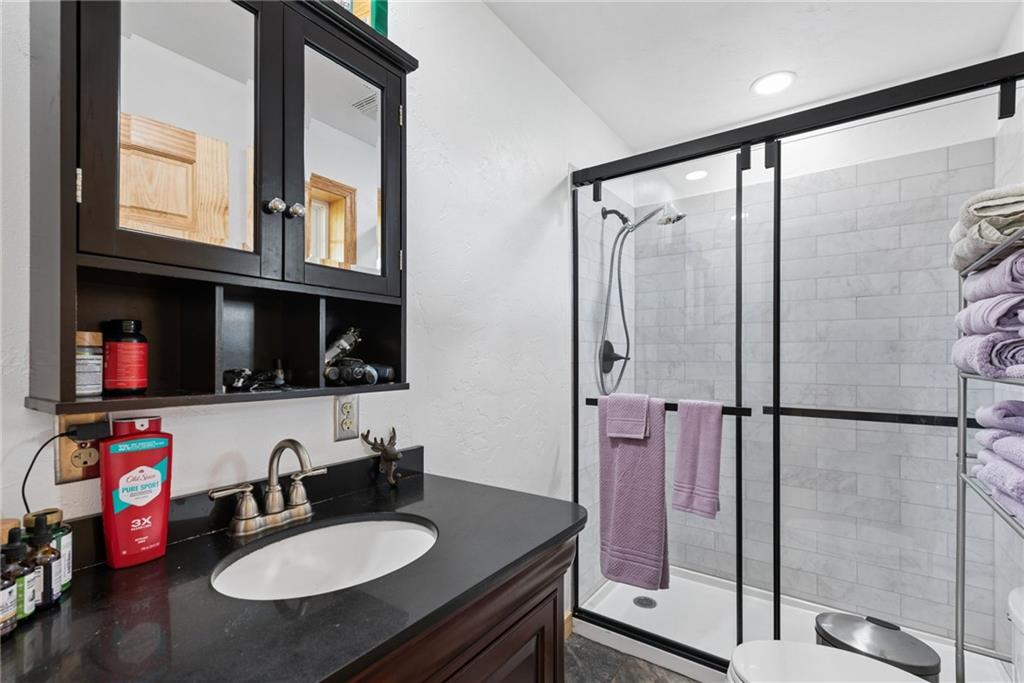 394 Mountain View Road New Florence, PA 15944 - Photo 20 of 37 a bathroom with a granite countertop shower sink and mirror