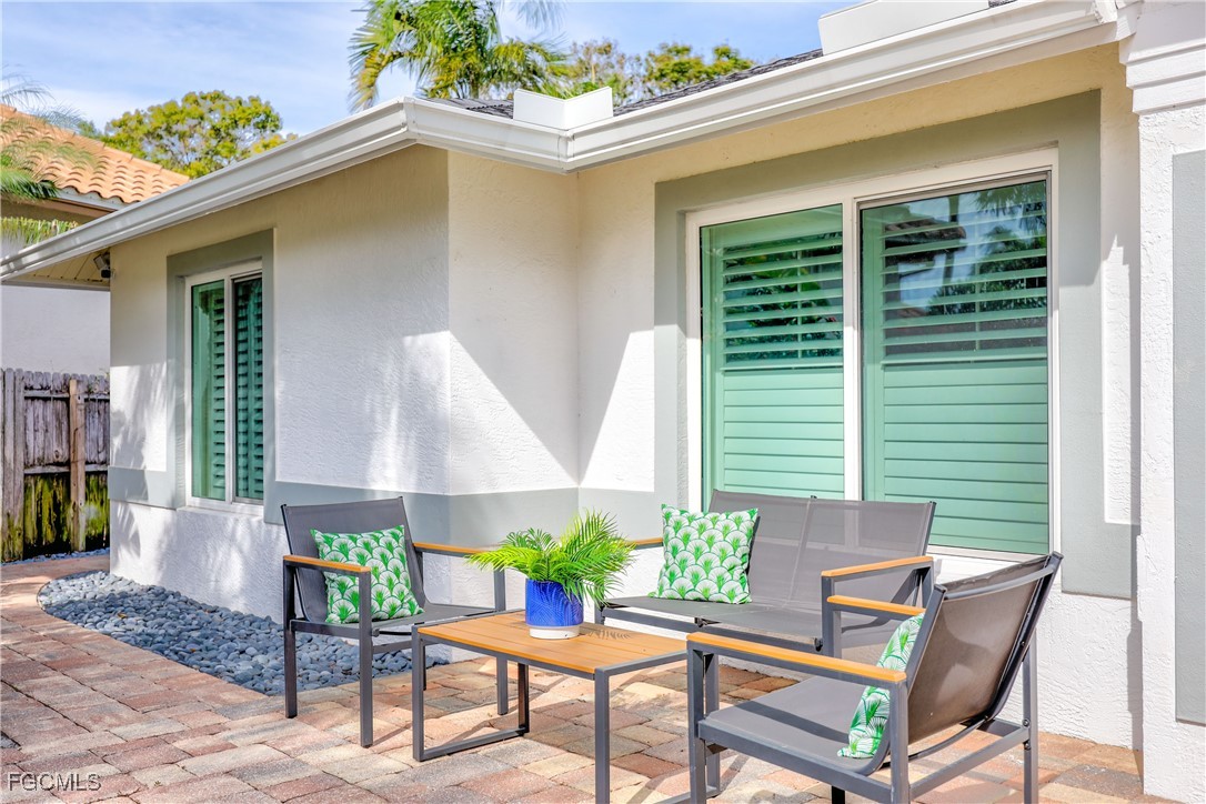 2003 Timberline Drive Naples, FL 34109 - Photo 13 of 44 a view of a house with backyard and sitting area