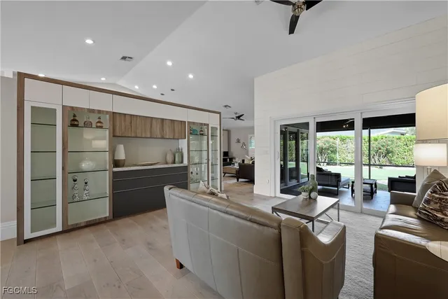 a kitchen with stainless steel appliances kitchen island granite countertop a refrigerator and a stove