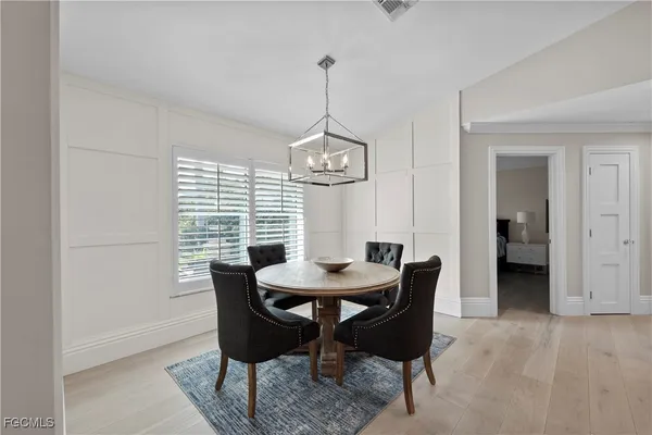 a dining room with furniture and window