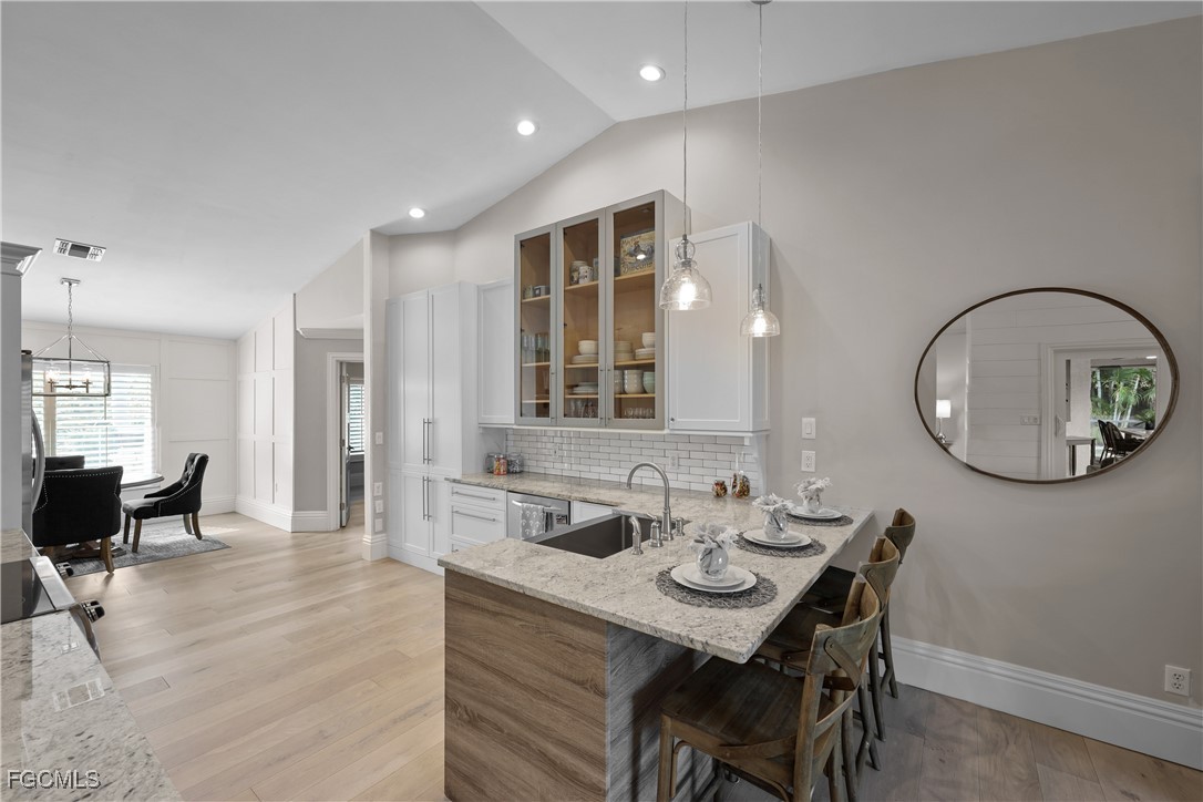 2003 Timberline Drive Naples, FL 34109 - Photo 24 of 44 a view of a dining room with furniture