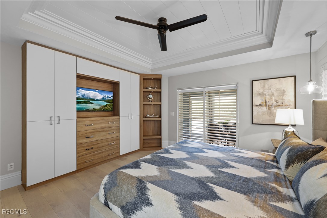 2003 Timberline Drive Naples, FL 34109 - Photo 27 of 44 a bedroom with a bed and a flat screen tv