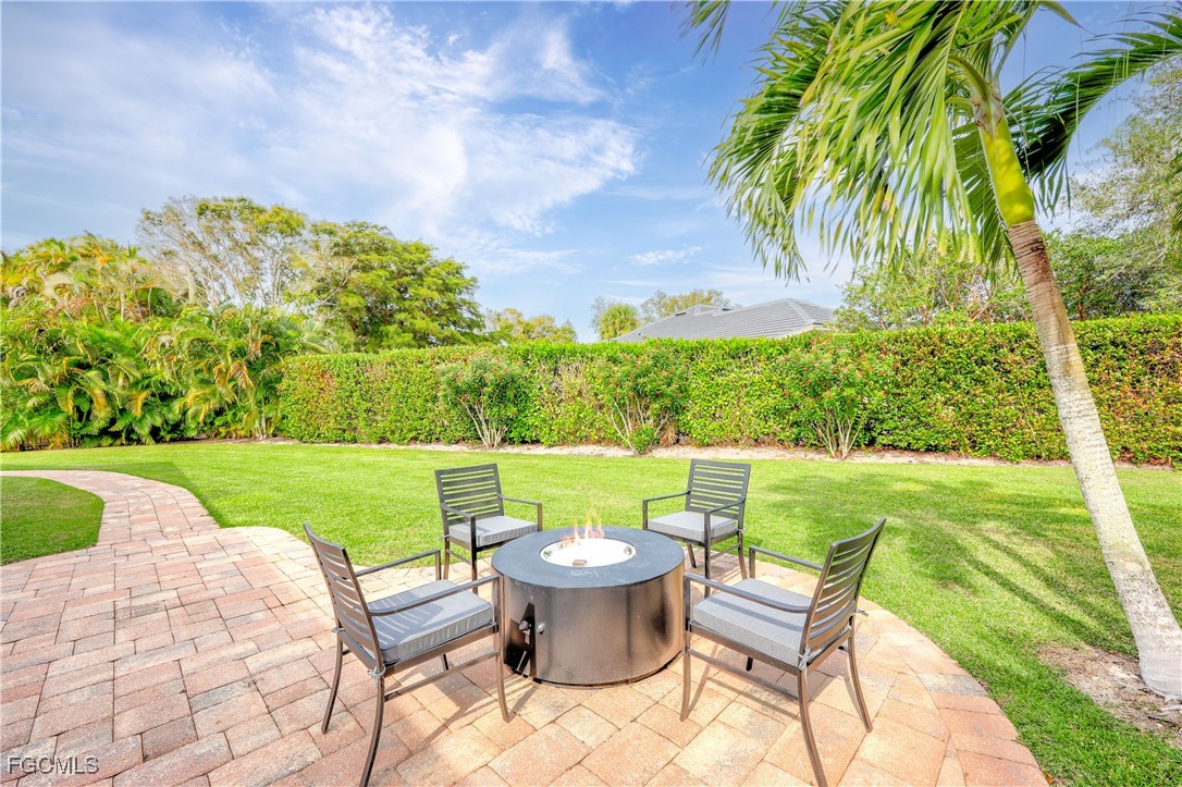 2003 Timberline Drive Naples, FL 34109 - Photo 39 of 44 a view of a chairs and table in the garden