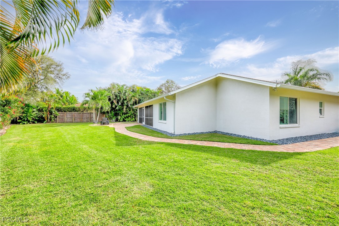 2003 Timberline Drive Naples, FL 34109 - Photo 41 of 44 a view of a house with a yard
