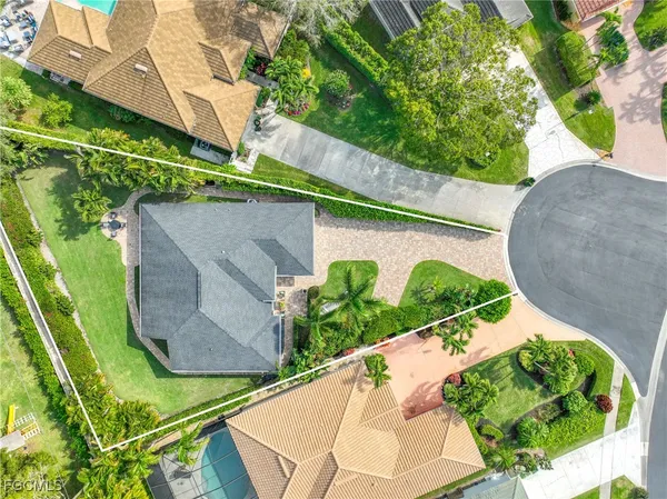 an aerial view of house with yard swimming pool and outdoor seating