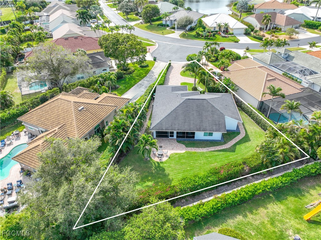 2003 Timberline Drive Naples, FL 34109 - Photo 44 of 44 an aerial view of house with yard swimming pool and outdoor seating