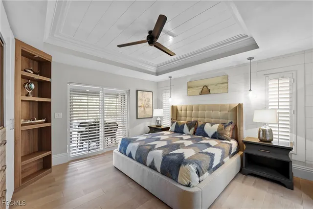 a bed room with a bed and a television