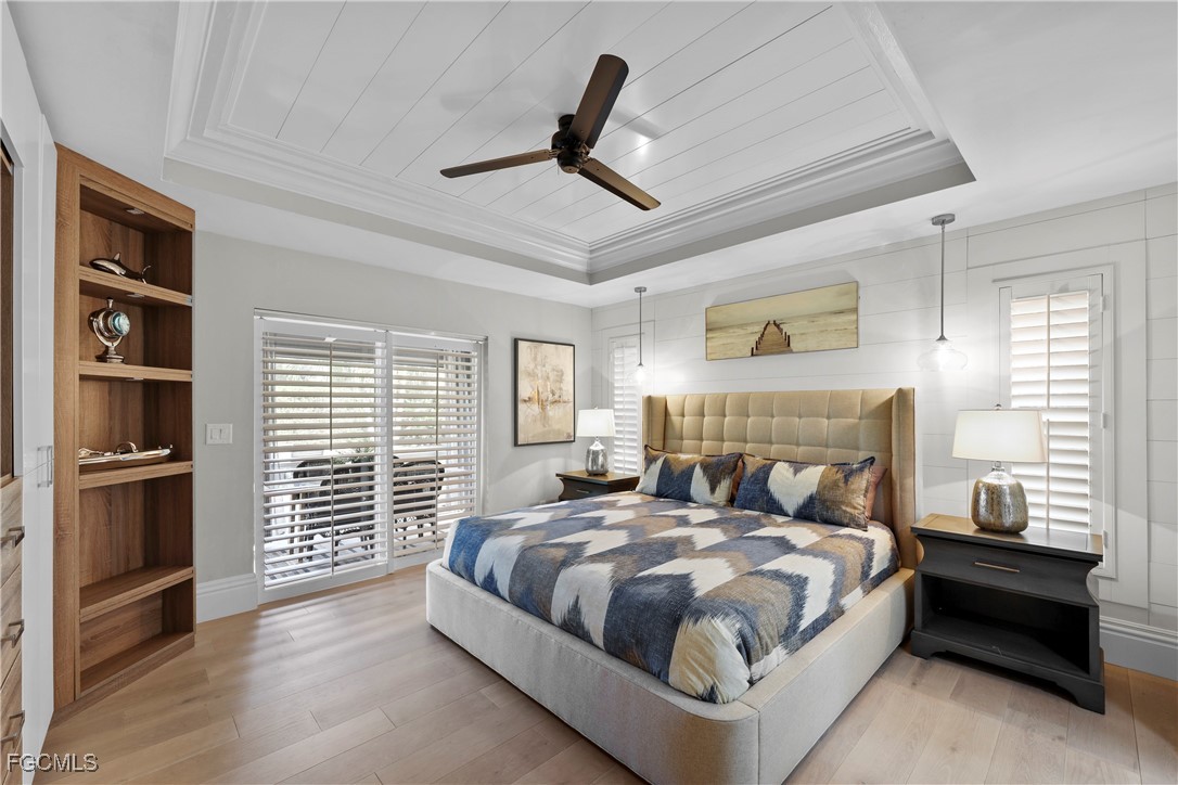 2003 Timberline Drive Naples, FL 34109 - Photo 5 of 44 a bed room with a bed and a television