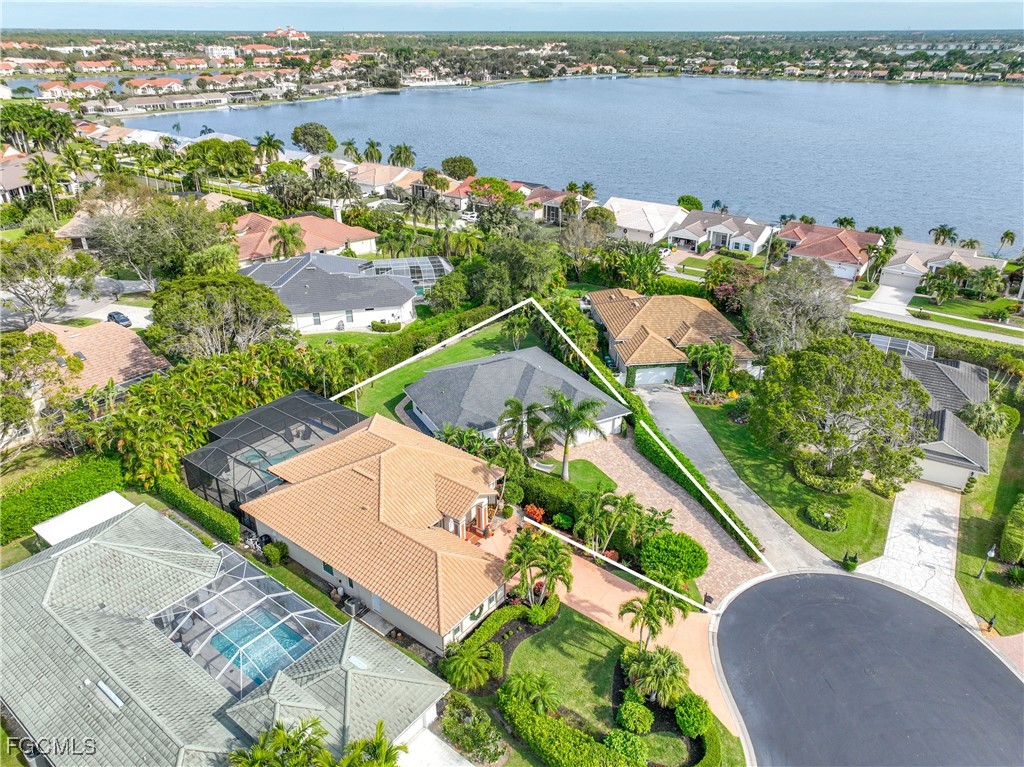2003 Timberline Drive Naples, FL 34109 - Photo 9 of 44 an aerial view of a residential houses with outdoor space and lake view