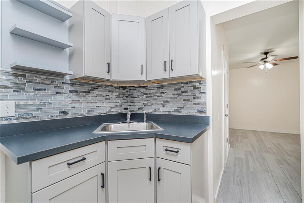 217 Brighton 1st Lane Brooklyn, NY 11235 - Photo 14 of 24 a kitchen with a sink and cabinets