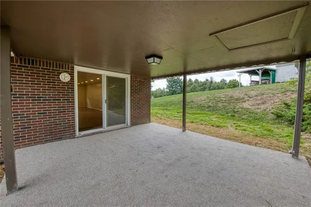 a view of a room with porch and wooden floor