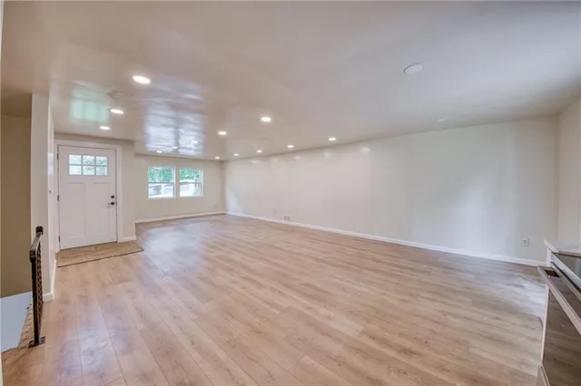 a view of an empty room and a window