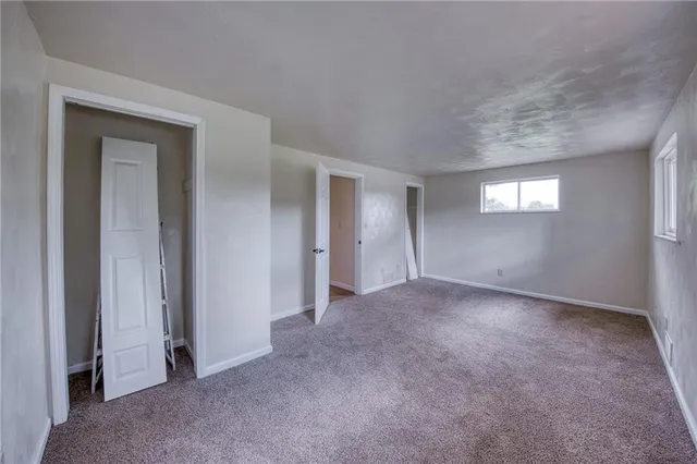 a view of an empty room and window