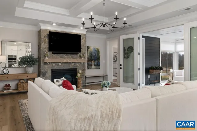 a living room with furniture fireplace and flat screen tv