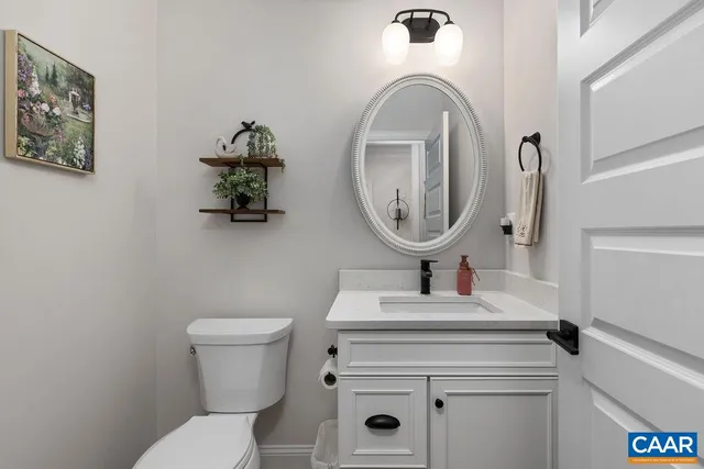 a spacious bathroom with a double vanity sink a mirror and a bathtub