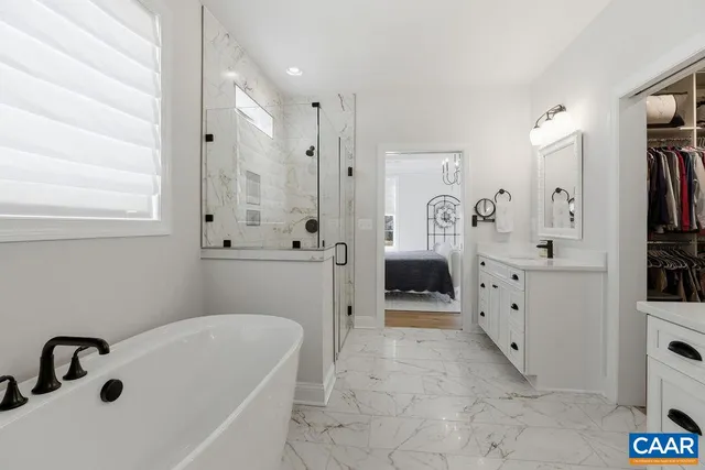 a bathroom with a bathtub and a toilet