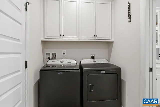 a view of a swimming pool with an outdoor seating and a yard