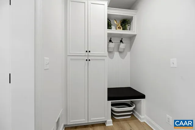 a view of a lake with houses in the background