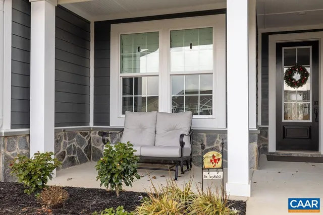 a front view of a house with large windows