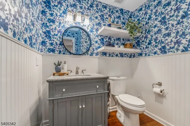 a bathroom with a toilet and a sink
