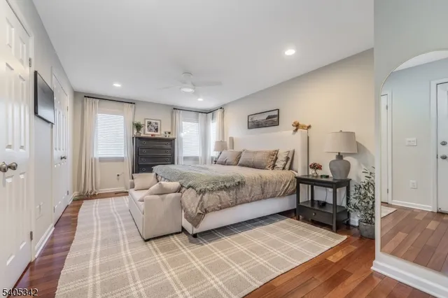 a bedroom with a bed and a table