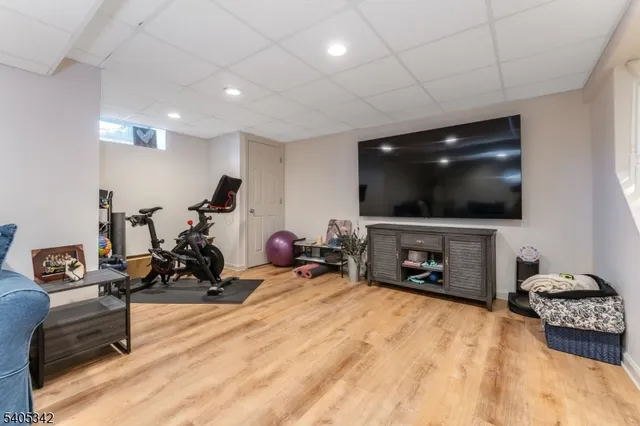 a room with furniture and a flat screen tv