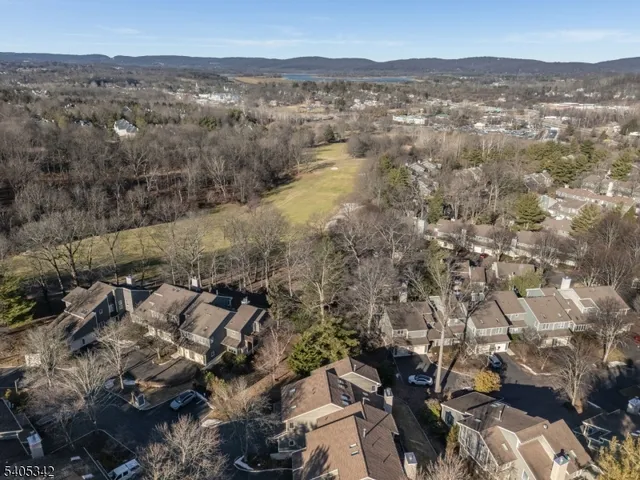 an aerial view of residential house and parking space