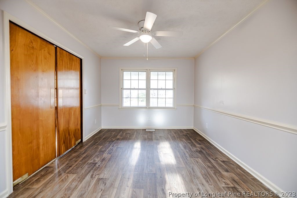 634 Richmond Road Rockingham, NC 28379 - Photo 13 of 40 wooden floor in an empty room with a window