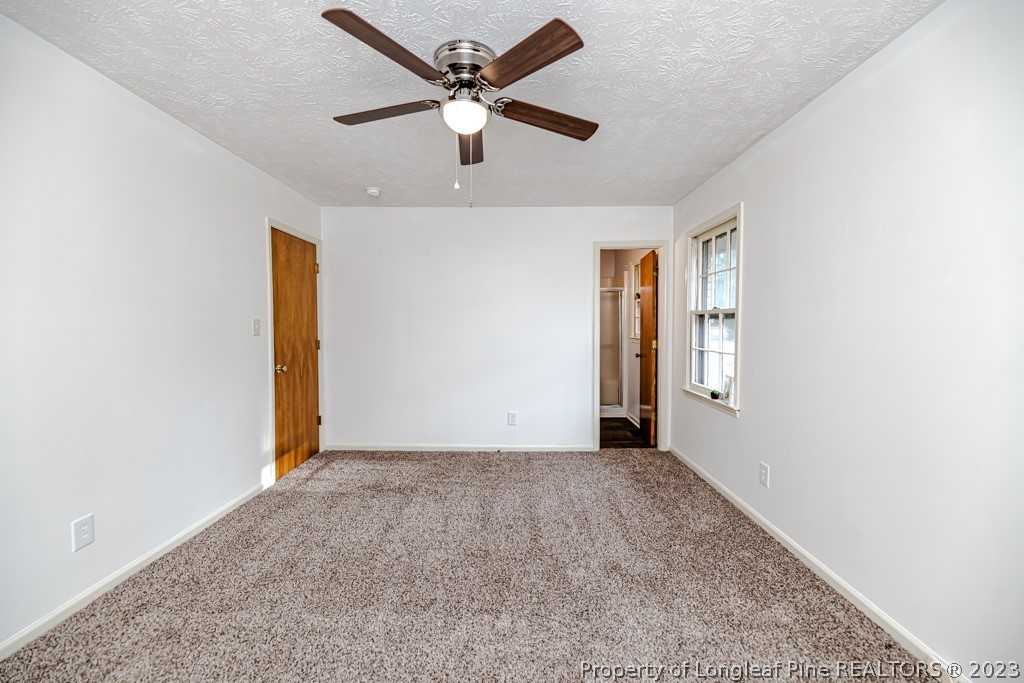 634 Richmond Road Rockingham, NC 28379 - Photo 16 of 40 an empty room with closet and windows