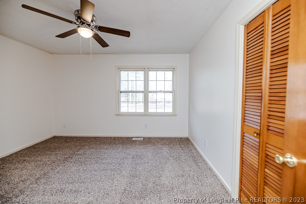 634 Richmond Road Rockingham, NC 28379 - Photo 24 of 40 a view of room with window and ceiling fan