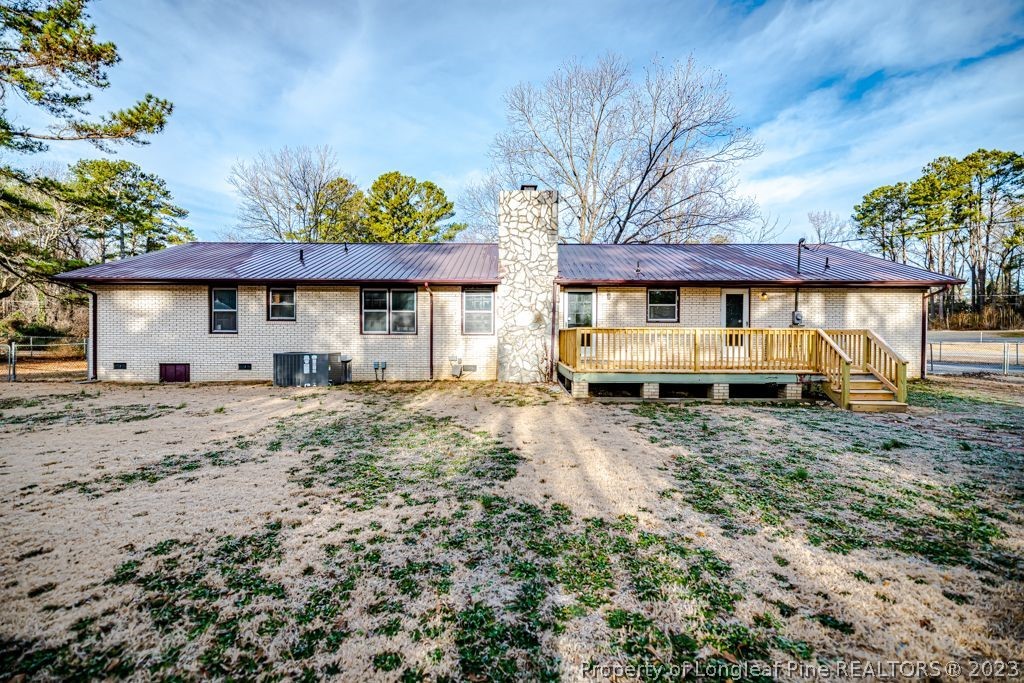 634 Richmond Road Rockingham, NC 28379 - Photo 35 of 40 a view of a house with a yard